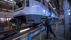 An employee carries out checks on a Movia C30 metro train for Stockholm Public Transport (SL) on the assembly line at the Bombardier Inc. factory in Hennigsdorf, Germany, on Wednesday, Nov. 18, 2020. Bombardier announced a deal earlier this year to divest its train unit to Alstom SA for $8.4 billion. Photographer: Krisztian Bocsi/Bloomberg