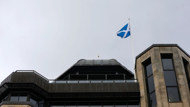 The Saltire, Scottish national flag, flies above the Standard Life Plc head office in Edinburgh, U.K., on Monday, March 6, 2017. Standard Life Plc, Scotland's largest insurer, agreed to acquire Aberdeen Asset Management Plc for about 3.8 billion pounds ($4.7 billion), a deal that would create the U.K.’s largest active manager. Photographer: Matthew Lloyd/Bloomberg