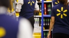 Employees restock shelves at Wal-Mart