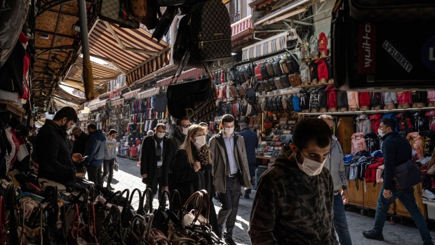 Pedestrians walk through a a busy retail street close to the Grand Bazaar in Istanbul, Turkey, on Wednesday, Feb. 2, 2021. Turkish inflation quickened for a fourth month as the lingering impact of a weak lira led to a broad-based rise in prices. Photographer: Nicole Tung/Bloomberg