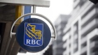 Signage is displayed outside of a Royal Bank of Canada (RBC) branch 