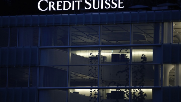 Lights illuminate deserted office space inside a Credit Suisse Group AG office building at night in Muri, Bern, Switzerland, on Monday, Feb. 15, 2021. Credit Suisse is expecting to post a fourth-quarter loss when it reports earnings on Feb. 18, after setting aside $850 million for U.S. legal cases including MBIA and booking a $450 million impairment on a hedge fund investment. Photographer: Stefan Wermuth/Bloomberg