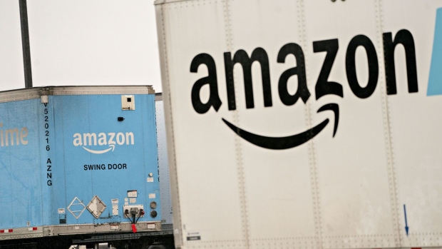 Amazon.com Inc. Prime branded semi-trailers sit at a fulfillment center in Baltimore, Maryland, U.S., on Monday, March 23, 2020. Amazon's delivery delays of non-essential goods will extend for at least another month for many customers in the U.S. and Europe, stirring panic among online merchants who rely on the web retailer for business. Photographer: Andrew Harrer/Bloomberg