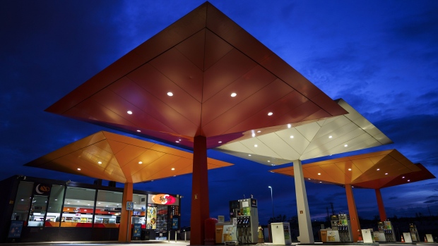 Overhead lighting illuminates pumps on the forecourt of a Repsol SA gas station as night falls in Madrid, Spain, on Monday, April 6, 2020. The world’s largest oil producers are inching closer to an unprecedented global deal to rescue the energy industry from collapse after the U.S. said production will drop dramatically.