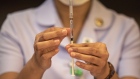 A nurse checks a dose of the AstraZeneca Covid-19 vaccine for air bubbles at the Bamrasnaradura Infectious Diseases Institute in Nonthaburi, Thailand, on Friday, March 12, 2021. Thailand’s Health Ministry said that the nation would temporarily halt the use of AstraZeneca Plc vaccines until there’s more clarity from the investigations of possible blood clots. The Prime Minister Prayuth Chan-Ocha and some of his cabinet members who were scheduled to get their AstraZeneca shots today have postponed their appointments after suspensions of the vaccine in some European countries, including in Denmark, Italy and Norway. Photographer: Andre Malerba/Bloomberg