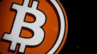 A bitcoin logo in the window of a bitcoin automated teller machine (ATM) kiosk in Barcelona, Spain, on Tuesday, Feb. 23, 2021. Bitcoin climbed, aided by supportive comments from Ark Investment Management’s Cathie Wood and news that Square Inc. boosted its stake in the cryptocurrency. Photographer: Angel Garcia/Bloomberg