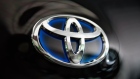 The Toyota Motor Corp. badge is seen on the company's Accessible People Mover (APM) mobility vehicle designed for the Tokyo 2020 Olympic and Paralympic Games at the company's office in Tokyo, Japan, on Friday, Aug. 2, 2019. Toyota cut its full-year profit outlook, hit by a strengthening yen that’s being fueled by increasingly acrimonious global trade tensions. Photographer: Akio Kon/Bloomberg