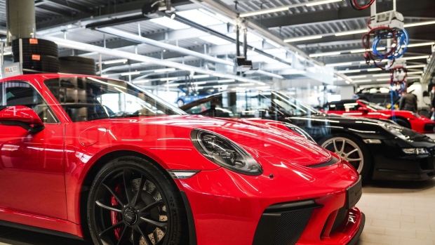 A Porsche 911 luxury automobile in the service garage at the Porsche SE showroom in Dortmund, Germany, on Thursday, March 18, 2021. Porsche report earnings on March 19. Photographer: Wolfram Schroll/Bloomberg