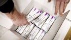 Boxes of AstraZeneca's Covid-19 vaccines in a cold store of Movianto in Oss. Photographer: REMKO DE WAAL/AFP