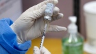 A nurse fills a syringe with a dose of the AstraZeneca Plc Covid-19 vaccine at a public health center in Incheon, South Korea, on Friday, Feb. 26, 2021. South Korea began utilizing AstraZeneca vaccines to inoculate patients and workers at nursing homes and related facilities who are younger than 65. Photographer: SeongJoon Cho/Bloomberg