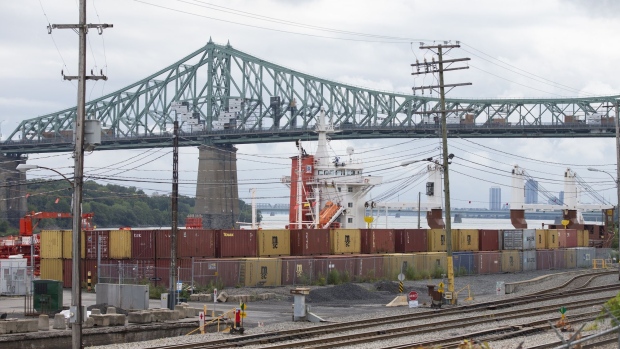 Railroad tracks pass shipping containers at the Port of Montreal in Montreal, Quebec, Canada, on Friday, Aug. 21, 2020. A strike at the port is showing few signs of progress deep into its second week, as concerns rise about the damage an extended shutdown could do to the Canadian economy, the Dow Jones reported.