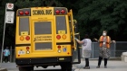 A school bus drops off a student at Portage Trail Community School in Toronto, Ontario, Canada, on Tuesday, Sept. 15, 2020. The Toronto District School Board is spreading the return to class over three days as part of a staggered reopening plan designed to help children get used to new Covid-19 safety protocols, The Canadian Press reports.