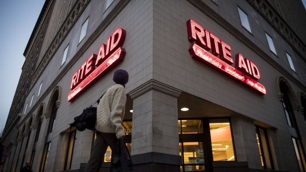 A pedestrian passes in front of a Rite Aid Corp. store in Oakland, California, U.S., on Friday, Dec. 29, 2017. Rite Aid Corp. is scheduled to release earnings figures on January 3. Photographer: David Paul Morris/Bloomberg