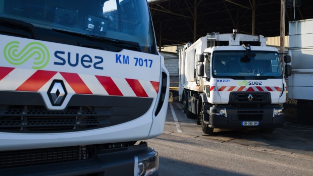 Garbage trucks, manufactured by Renault SA, at a Suez SA depot in Paris, France, on Monday, March 1, 2021. Suez set a high bar for any resumption of talks about Veolia Environnement SA's takeover offer, after issuing yet another emphatic rejection of its rival’s proposal.