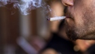 A customer smokes marijuana at the Lowell Cafe, a new cannabis lounge in West Hollywood, California, U.S., on Tuesday, Oct. 1, 2019. America's first cafe to allow the consumption of cannabis offers an extension to the market, where sales are largely confined to dispensaries and online orders, and tests the appetite for a more open and public consumption of a product that's still illegal in many jurisdictions. Photographer: Kyle Grillot/Bloomberg