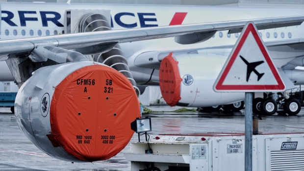 A protective cover sits on the CFM International SA CFM56 engine of a passenger aircraft, operated by Air France-KLM, grounded on the tarmac at Blagnac Airport in Toulouse, France, on Tuesday, June 9, 2020. The French government unveiled a rescue plan for the struggling aerospace industry that includes billions of euros to support Airbus SE and its suppliers hard hit by the Covid-19 pandemic.