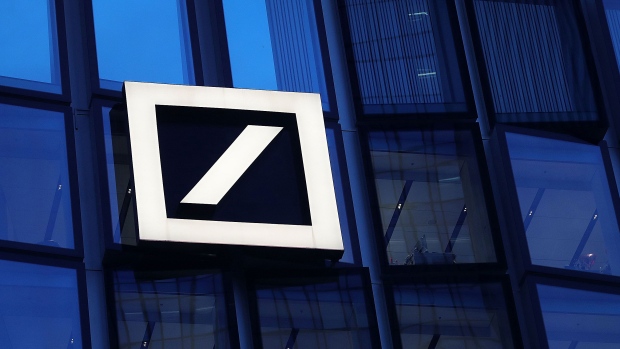 The Deutsche Bank AG logo sits on the bank's campus office building in Frankfurt, Germany, on Thursday, Jan. 31, 2019. On the eve of fourth-quarter results that are likely to reflect its troubles, Deutsche Bank AGs ability to avoid a government-brokered merger with Commerzbank could rest on its performance in the first quarter of 2019, according to people briefed on the thinking of its top executives. Photographer: Krisztian Bocsi/Bloomberg