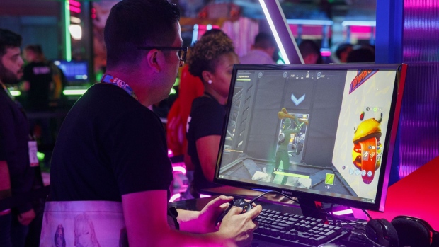 An attendee plays the Epic Games Inc. Fortnite video game during the E3 Electronic Entertainment Expo in Los Angeles, California, U.S., on Tuesday, June 11, 2019. For three days, leading-edge companies, groundbreaking new technologies and never-before-seen products are showcased at E3. Photographer: Patrick T. Fallon/Bloomberg