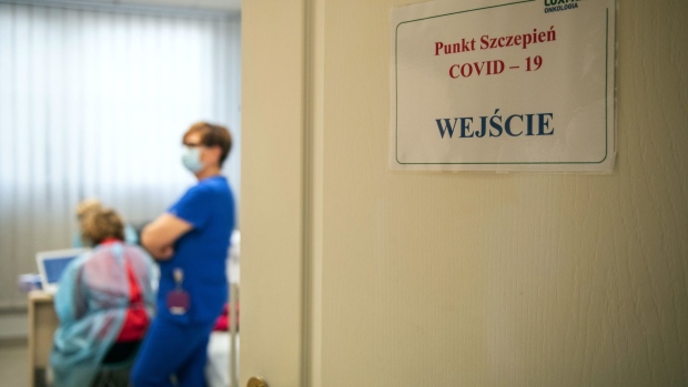 Health care workers in a Covid-19 vaccination room at the Lux Med oncology hospital in Warszawa, Poland, on Thursday, Feb. 25, 2021. The country of 38 million has so far administered 2,990,683 vaccine doses, including 1,031,518 with second dose.