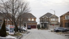 A "For Sale" sign in front of a row of homes in a subdivision in Vaughan, Ontario, Canada, on Thursday, March 11, 2021. The buying, selling and building of homes in Canada takes up a larger share of the economy than it does in any other developed country in the world, according to the Bank of International Settlements, and also soaks up a larger share of investment capital than in any of Canada’s peers. Photographer: Cole Burston/Bloomberg