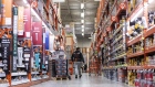 A employee walks down an aisle at a Home Depot Inc. store in Chicago, Illinois, U.S., on Monday, Nov. 23, 2020. For the first time ever on Black Friday, more consumers intend to shop online than in stores, a switch driven by the coronavirus pandemic, according to a survey by Deloitte. Photographer: Christopher Dilts/Bloomberg