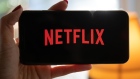 The Netflix Inc. logo on a smartphone arranged in Seattle, Washington, U.S., on Saturday, Jan. 23, 2021. Netflix Inc. ended its biggest year in company history with a bang, powering its stock to intraday and closing highs after adding more customers than expected and saying it no longer needs to borrow money to build its entertainment empire. Photographer: Chona Kasinger/Bloomberg
