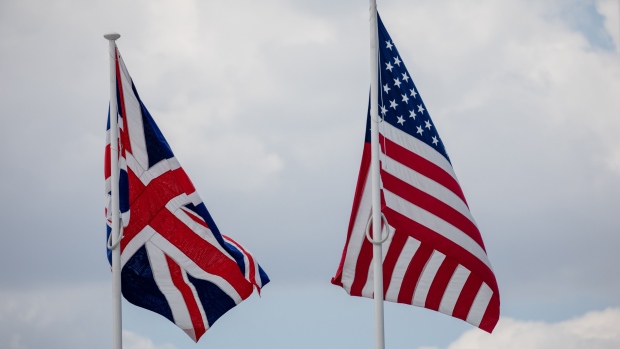 A British Union flag, also known as the Union Jack, left, flies beside a U.S. national flag during the North Atlantic Treaty Organization (NATO) summit at the military and political alliance's headquarters in Brussels, Belgium, on Wednesday, July 11, 2018. President Donald Trump opened up another front in his tussle with allies on his arrival at NATO’s annual summit, targeting Germany over its support for the Nord Stream 2 gas pipeline from Russia. Photographer: Marlene Awaad/Bloomberg