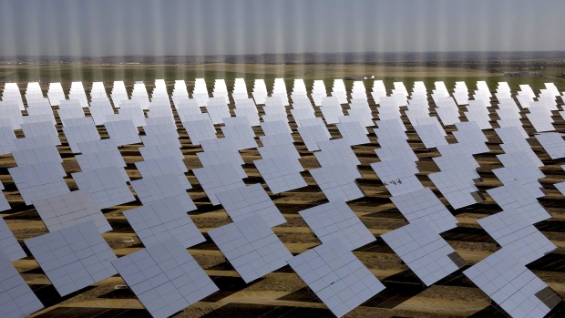 Solar panels redirect the sun's rays near Seville, Spain.