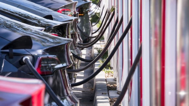 Tesla vehicles at a Tesla Supercharger station in Concord, California. Photographer: David Paul Morris/Bloomberg