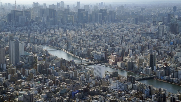 The Sumida River flows through Tokyo, Japan, on Friday, Dec. 25, 2020. Japan's infrastructure is already one of the world’s safest, and investment in mitigating natural disasters is ramping up. Photographer: Toru Hanai/Bloomberg