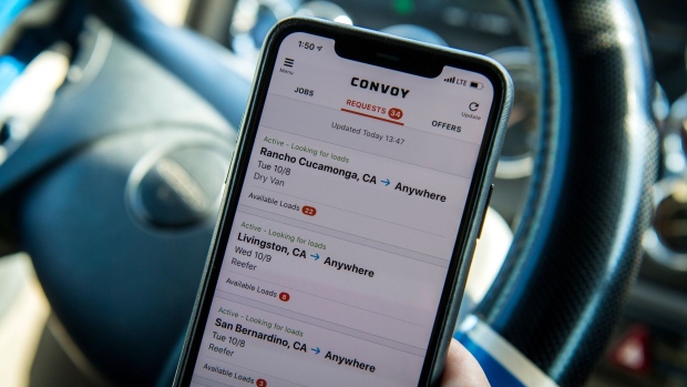 The Convoy Inc. application is displayed on a smartphone in an arranged photograph taken in Patterson, California, U.S., on Monday, Oct. 7, 2019. Convoy hooked truck drivers with an app to easily find jobs and get paid quickly. Now it needs to address concerns about low prices and figure out how to turn a profit.
