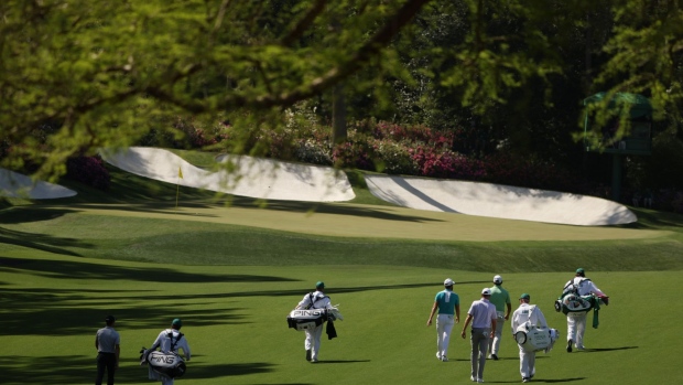 Tony Finau, Marc Leishman, Adam Scott, and Matt Jones skip their balls across the pond on the 16th hole during a practice round prior to the Masters at Augusta National Golf Club on April 7. Photographer: Jared C. Tilton/Getty Images 