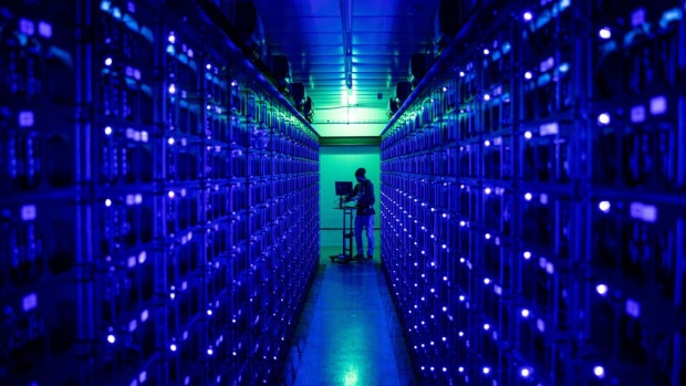 An engineer runs diagnostics on rigs mining the Ethereum and Zilliqa cryptocurrencies at the Evobits crypto farm in Cluj-Napoca, Romania, on Wednesday, Jan. 22, 2021. The worlds second-most-valuable cryptocurrency, Ethereum, rallied 75% this year, outpacing its larger rival Bitcoin. Photographer: Bloomberg/Bloomberg
