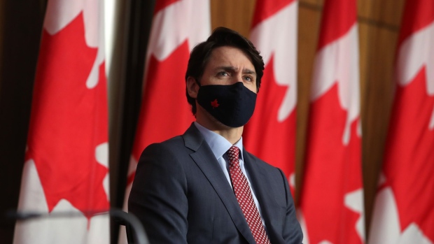 Justin Trudeau, Canada's prime minister, listens during a news conference in Ottawa, Ontario, Canada, on Friday, March 19, 2021. Trudeau said that the U.S. and Canada are finalizing the details on the AstraZeneca Covid-19 vaccine shipment.
