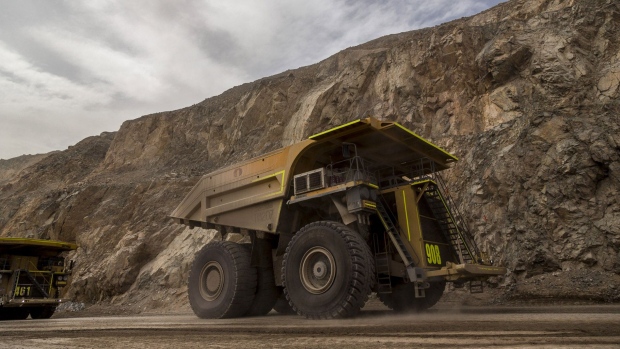 Trucks transport minerals inside the Codelco Chuquicamata open pit copper mine near Calama, Chile. Photographer: Cristobal Olivares/Bloomberg