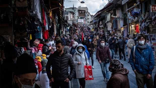 ISTANBUL, TURKEY - APRIL 09: People wearing protective face masks shop ahead of the start of the holy month of Ramadan on a busy market street on April 09, 2021 in Istanbul, Turkey. Turkey announced more than 55,000 new Covid-19 cases in the past 24hrs, a new daily record since the start of the pandemic. Turkey recently lifted restrictions allowing restaurants and cafes to reopen for indoor and outdoor dining during limited hours. Fears are growing that coronavirus cases will continue to rise as the country prepares to celebrate the holy month of Ramadan starting on April 13. (Photo by Chris McGrath/Getty Images)
