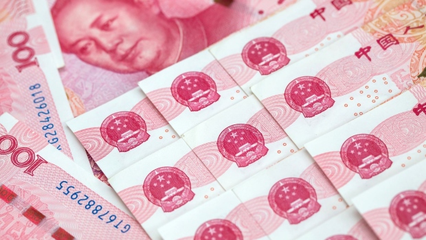 The portrait of former Chinese leader Mao Zedong is displayed on a Chinese one-hundred yuan banknote in an arranged photograph taken in Hong Kong, China, on Thursday, April 23, 2020. The People's Bank of China (PBOC) has cut short- and medium-term rates recently on top of liquidity injections, loan rollovers and easier regulatory rules.