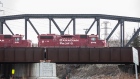 A Canadian Pacific Railway locomotive moves over a bridge in Calgary, Alberta, Canada, on Monday, March 22, 2021. Canadian Pacific Railway Ltd. agreed to buy Kansas City Southern for $25 billion, seeking to create a 20,000-mile rail network linking the U.S., Mexico and Canada in the first year of those nations; new trade alliance.