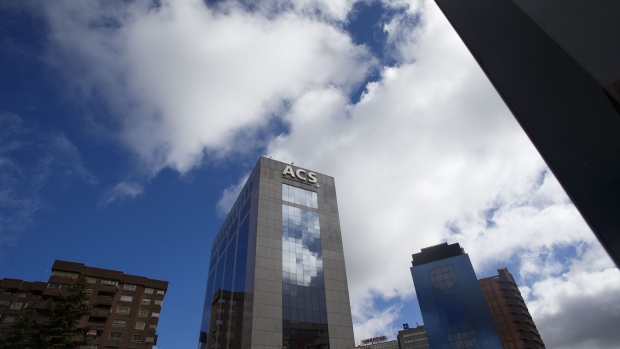 A logo sits on display outside the headquarters of ACS Actividades de Construccion y Servicios SA in Madrid, SpAin, on Thursday, March 15, 2018. ACS on Wednesday reached an agreement with rival suitor Atlantia SpA to construct a joint 18.2 billion euro ($22.5 billion) takeover of SpAnish toll-road operator Abertis Infraestructuras SA. Photographer: Angel Navarrete/Bloomberg