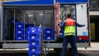 An employee of Tesco Plc unloads groceries from a truck as he prepares a delivery in London, U.K., on Wednesday, Sept. 30, 2020. Covid-19 lockdown enabled online and app-based grocery delivery service providers to make inroads with customers they had previously struggled to recruit, according the Consumer Radar report by BloombergNEF. Photographer: Hollie Adams/Bloomberg