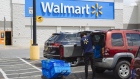 A worker delivers groceries to a customer's vehicle outside a Walmart Inc. store in Amsterdam, New York, U.S., on Friday, May 15, 2020. With the spread of coronavirus slowing in New York, Governor Andrew Cuomo said Monday the state economy is ready to begin reopening, with some regions authorized to do so as soon as this week.