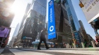 Monitors display Coinbase signage during the company's initial public offering (IPO) at the Nasdaq MarketSite in New York, U.S., on Wednesday, April 14, 2021.