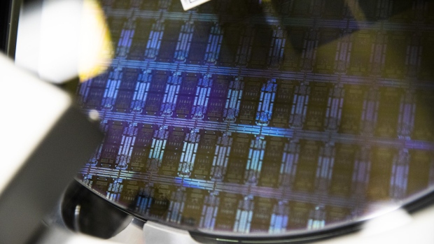 A wafer is processed in a single wafer diffusion mechanism inside the GlobalFoundries semiconductor manufacturing facility in Malta, New York, U.S., on Tuesday, March 16, 2021. Production plants for semiconductors have become a focal point as the economic recovery from the pandemic is held back in areas by a shortage of some of the critical electronic components necessary. Photographer: Adam Glanzman/Bloomberg