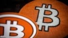A bitcoin logo on the carpet of a bitcoin automated teller machine (ATM) kiosk in Barcelona, Spain, on Tuesday, Feb. 23, 2021. Bitcoin climbed, aided by supportive comments from Ark Investment Management’s Cathie Wood and news that Square Inc. boosted its stake in the cryptocurrency.