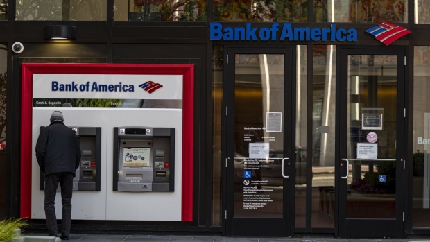 A person uses an automated teller machine (ATM) at a Bank of America bank branch in San Francisco, California, U.S., on Tuesday, April 13, 2021. Bank of America Corp. is scheduled to release earnings figures on April 15.