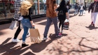 Shoppers carry bags on Market Street in San Francisco. Photographer: David Paul Morris/Bloomberg