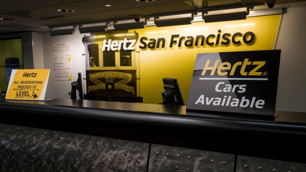 Signage is displayed at the Hertz Global Holdings Inc. rental counter at San Francisco International Airport in San Francisco.