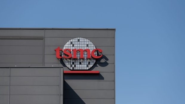 Logo at the Taiwan Semiconductor Manufacturing Co. headquarters in Hsinchu, Taiwan, on Wednesday, April 7, 2021. The TSMC is a key supplier to Apple, and it’s the iPhone maker’s commitment to become carbon neutral by 2030 that is driving much of the change throughout the supply chain. Photographer: Billy H.C. Kwok/Bloomberg