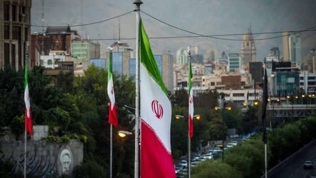 Iranian national flags fly near a major highway through Tehran, Iran, on Tuesday, Sept. 17. 2019. Iranian Foreign Minister Mohammad Javad Zarif refused to rule out military conflict in the Middle East after the U.S. sent more troops and weapons to Saudi Arabia in response to an attack on oil fields the U.S. has blamed on the Islamic Republic.