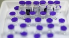 Vials of Covid-19 vaccine, produced by Pfizer Inc. and BioNTech SE, in cold storage at the Covid-19 vaccination center inside France's national velodrome in the Saint-Quentin-en-Yvelines district of Paris, France, on Wednesday, March 24, 2021.